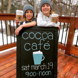 Girls at their Cocoa Cafe fundraiser